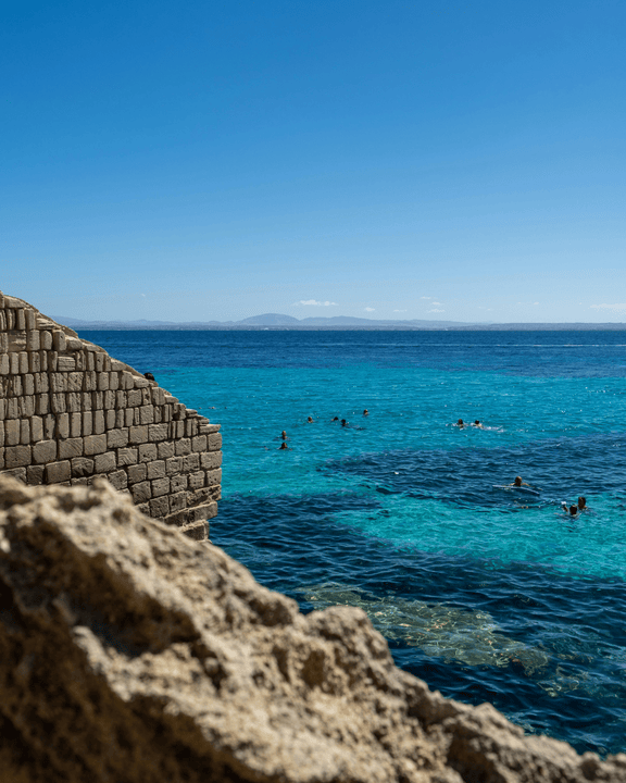 Mediterranean Sea View with Swimming Tourists