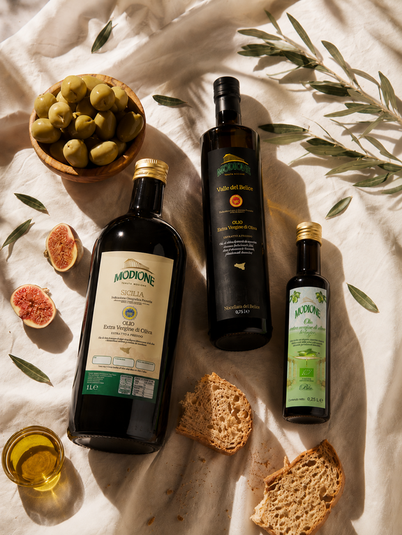 olio modione 3 bottiglie su tavola